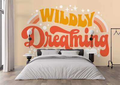 Wildly dreaming - inspiration quote in retro colors with stars, clouds, rainbow illustrations. Motivation lettering phrase in trendy 70s groovy style. Isolated typography design element Wall mural